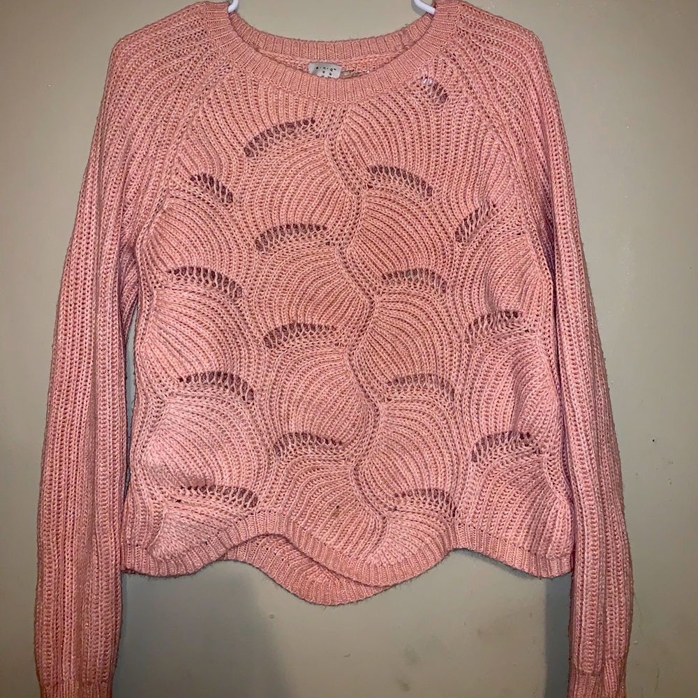It’s a pink shirt/sweater